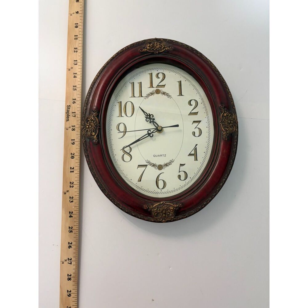 Vintage Brown Oval wooden framed wall clock with ornate gold accents